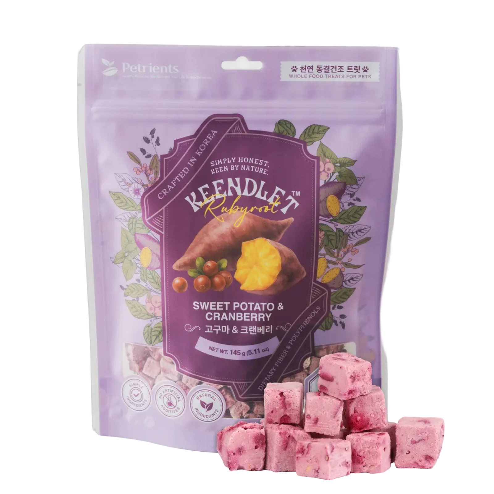 A purple stand-up pouch of Keendle Naturals Sweet Potato & Cranberry pet treats, shown with several pink cube-shaped treats arranged in front on a white background.