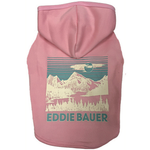 A pink dog hoodie with a vintage-style mountain landscape graphic on the back, featuring the text 'EDDIE BAUER' in teal. The hoodie is shown against a plain white background.