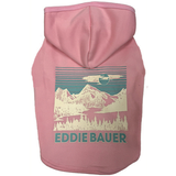 A pink dog hoodie with a vintage-style mountain landscape graphic on the back, featuring the text 'EDDIE BAUER' in teal. The hoodie is shown against a plain white background.