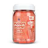 A clear plastic jar of Weruva Puddy Pops! Tuna & Salmon lickable cat treats with a white ribbed cap, shown on a clean white background.