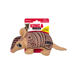 Kong Armadillo squeaker dog toy in its original retail packaging, featuring a tan armadillo plush toy with black stripes and a red squeaker mechanism visible underneath, set against a plain white background.