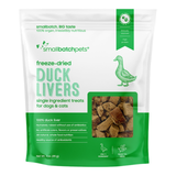 Green package of smallbatchpets freeze-dried duck livers treats for pets on a white background