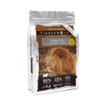A bag of Timber Wolf Dakota pet food, formulated for cats. The packaging is white and brown with a large photo of a male lion on the front, and features product details like 85% animal protein and 15% fruits and vegetables.
