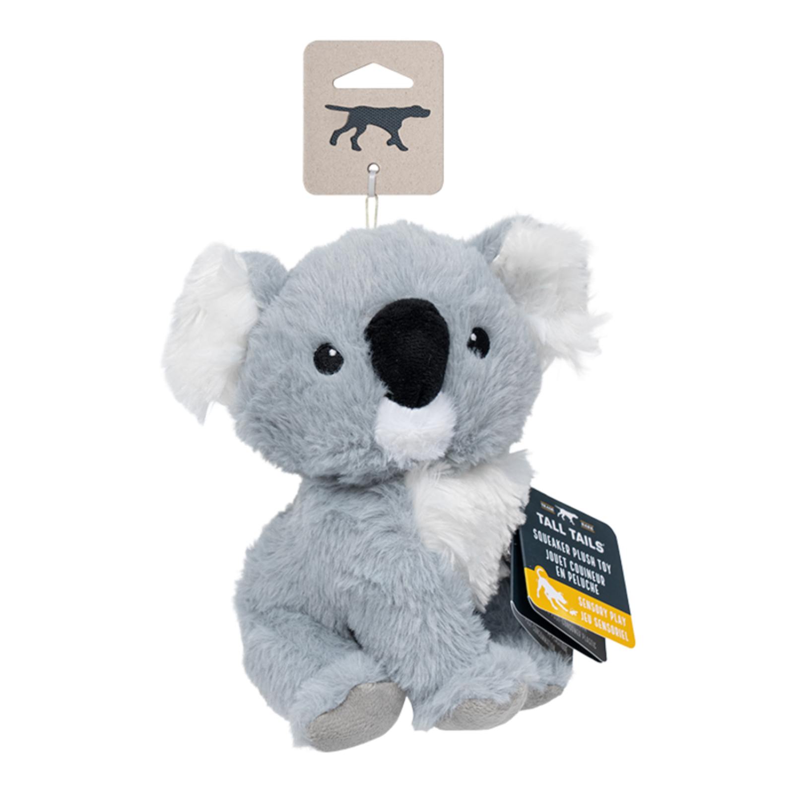 A plush koala dog toy by Tell-Tails, featuring gray faux fur, white inner ears and chest, and a black snout. It is shown hanging from its original cardboard display card with a black and yellow product tag.