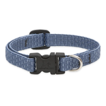 A blue woven fabric dog collar with a black plastic quick-release buckle and a silver metal D-ring, shown on a plain white background.