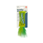 A Huxley & Kent 'Lappy Taffy' cat toy on its original retail card packaging, featuring a bright green feather attached to a lime-yellow plastic loop.