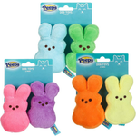 Four packages of Peeps plush dog toys on a white background, each containing two marshmallow-shaped bunny toys in different colors: light blue, green, pink, purple, orange, and yellow.