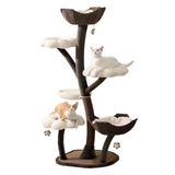 A multi-level cat tree with a dark brown faux-wood trunk and branches, cream plush cloud perches, woven wicker bowls, and hanging toys, shown with two cats resting on the levels against a plain white background.