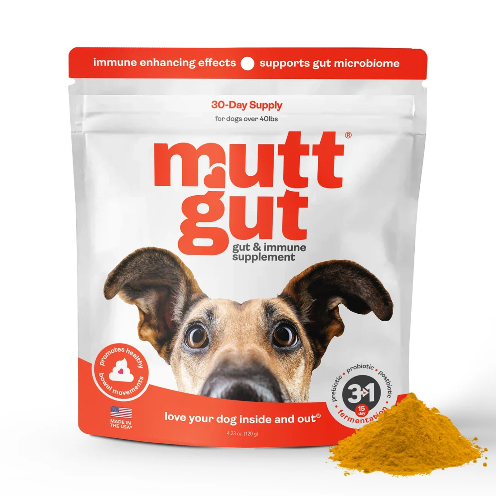 A stand-up pouch of mutt gut and immune supplement for dogs, shown on a white background with a small pile of yellow-orange powder in front. The package is white with bold red and orange branding and features a large dog face on the front.