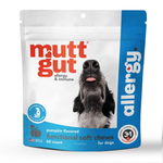 A stand-up pouch of mutt gut Allergy & Immune functional soft chews for dogs, featuring a white and blue package design with a photo of a black and white dog on the front.