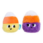 Two small plush candy corn toys on a plain white background. One is a soft yellow plush with an orange band and white tip, and the other is a fuzzy purple plush with an orange band and white tip.