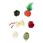 Six small plush toy crafts arranged on a plain white background, including a dark green pom-pom, a carrot-shaped orange with green tufts, a pale yellow bow with red tassels, a red pom-pom, a white flower-like plush, and a green balloon-like character with a small silver bell.