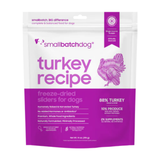 A stand-up pouch of Small Batch Dog Turkey Recipe freeze-dried sliders for dogs, featuring a white and purple design with a purple turkey illustration.