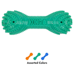 A green KONG rubber bone-shaped dog toy with textured nubs, shown on a white background with smaller orange, green, and blue versions below and the text 'Assorted Colors'.