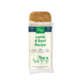 A packaged pet food bar labeled 'My Perfect Pet Lamb & Beef Recipe' on a plain white background. The wrapper is mostly off-white with green text and illustrations, and the top section is removed to show the textured brown and green food inside.