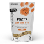 A stand-up pouch of Pawse Bark-Less Bites Lamb CBD freeze-dried dog treats on a clean white background. The packaging is white with a large orange paw print, black text, and a clear window at the bottom showing the beige freeze-dried treats inside.