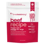 A stand-up pouch of Small Batch Dog 'Beef Recipe' frozen raw patties for dogs, featuring a white top half and a deep red bottom half with pink text and graphics.