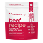A 3 lb stand-up pouch of smallbatchdog beef recipe frozen raw sliders for dogs, featuring a white top half and a deep red bottom half with pink text and a pink cow illustration.