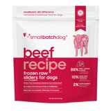 A 3 lb stand-up pouch of smallbatchdog beef recipe frozen raw sliders for dogs, featuring a white top half and a deep red bottom half with pink text and a pink cow illustration.
