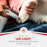 Person using a pet nail trimmer with a built-in LED light on a dog's paw.