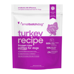 A stand-up pouch of Small Batch Dog 'Turkey Recipe' frozen raw patties for dogs, featuring a white and purple design with a purple turkey illustration.