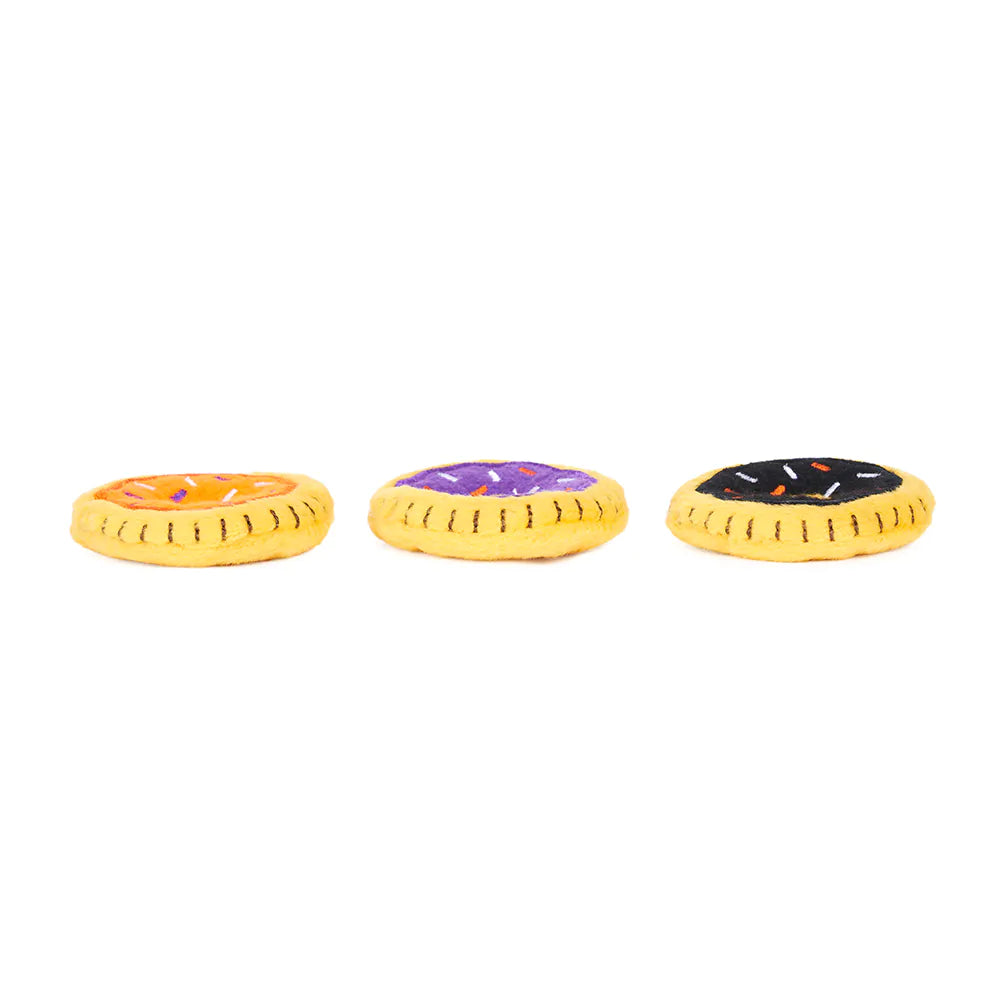 Three colorful donut-shaped toys on a white background