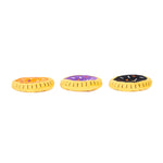 Three colorful donut-shaped toys on a white background