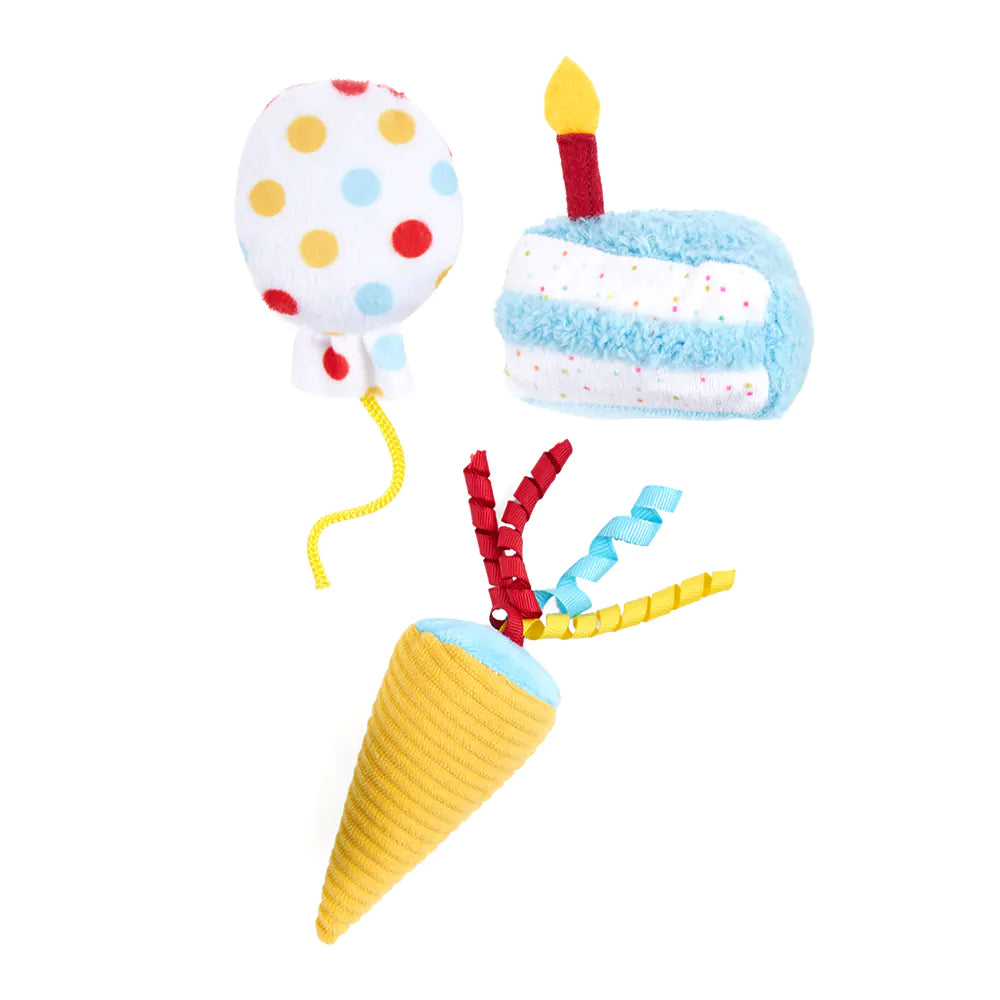 Colorful toy set with balloon, cake, and ice cream cone on a white background