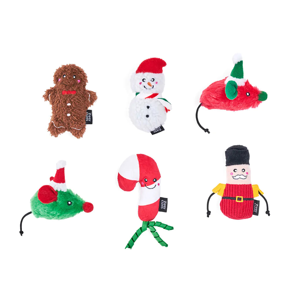 Set of Christmas-themed dog toys on a white background