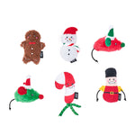 Set of Christmas-themed dog toys on a white background