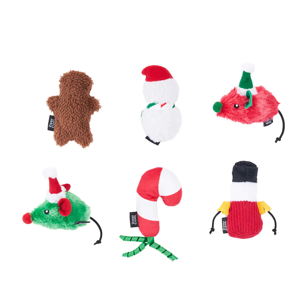 Set of Christmas-themed dog toys on a white background