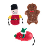 Three Christmas-themed dog toys on a white background