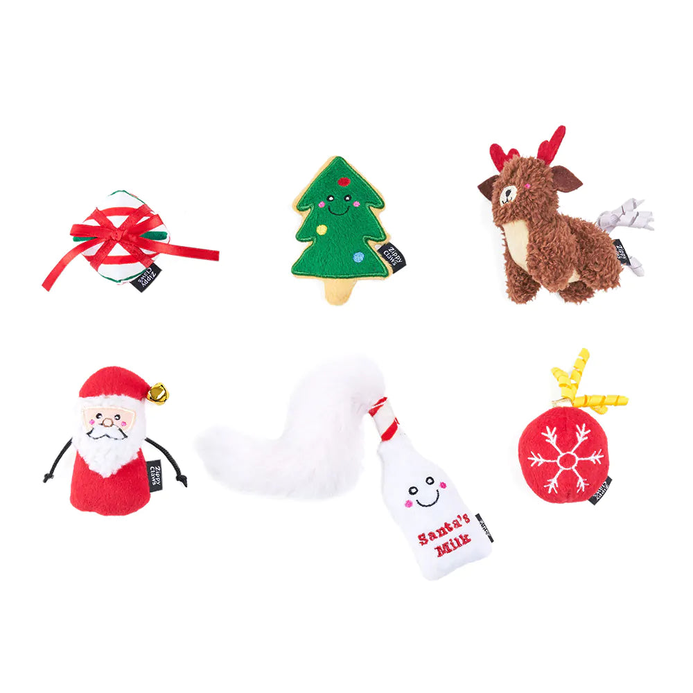 Set of Christmas-themed dog toys including a reindeer, Santa Claus, Christmas tree, and sock on a white background.