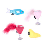 Set of colorful cat toys including a fish, glass, and pear shape on a white background