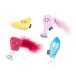 Four colorful dog toys with smiling faces on a white background