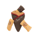 Plush toy resembling a chocolate-covered churro with smiling faces on a white background