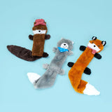 Three plush animal toys resembling a fox, wolf, and raccoon on a light blue background