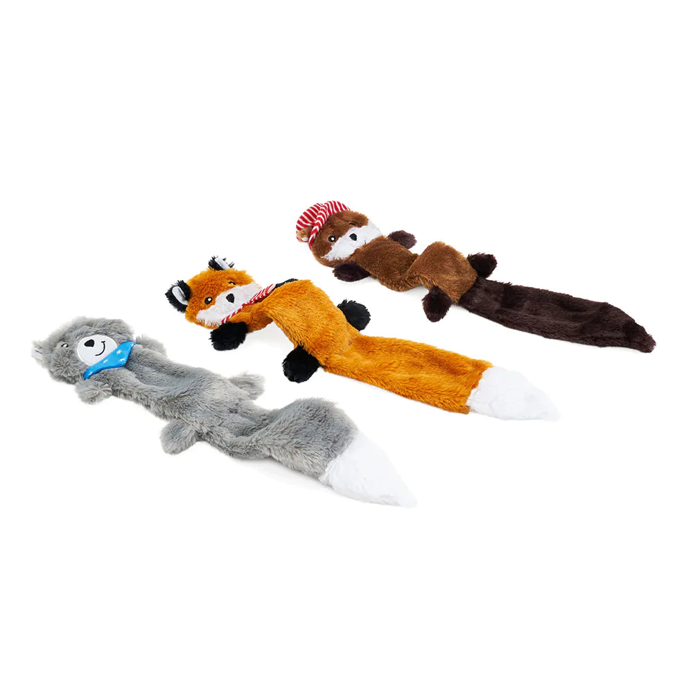 Set of four animal-shaped dog toys on a white background
