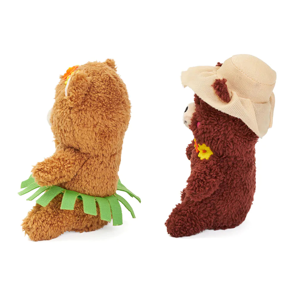 Two plush toys resembling bears on a white background