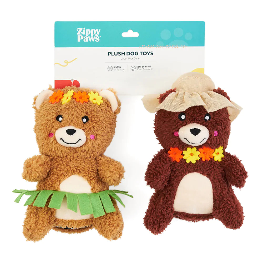 Two plush dog toys with floral accessories on a white background, branded as Zippy Paws.