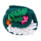 Toy resembling a roll of sushi with green, pink, orange, and white colors on a white background