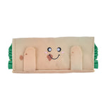 Toy with a face design on a beige background