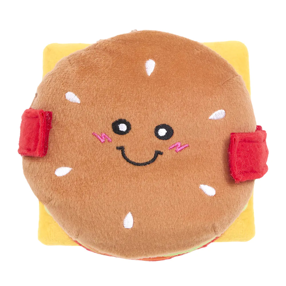 Plush toy shaped like a sandwich with a smiling face on a white background