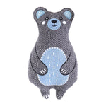 Stuffed bear toy with gray and blue pattern on a white background