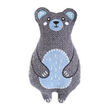 Stuffed bear toy with gray and blue pattern on a white background