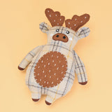 Plush toy reindeer with plaid pattern on a beige background