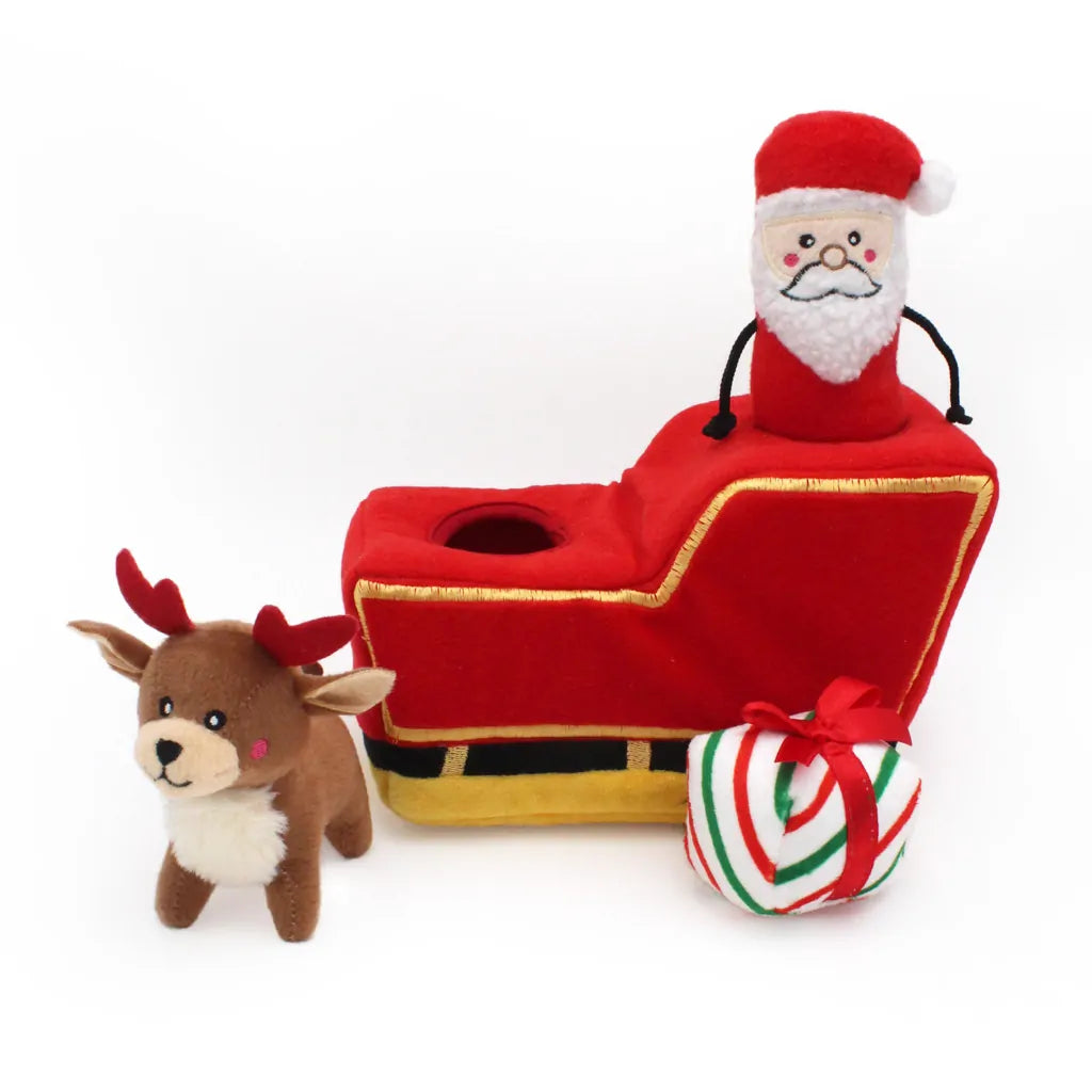 Plush Santa Claus toy with sleigh, reindeer, and candy cane on a white background