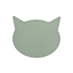 Green cat-shaped placemat on a light gray background