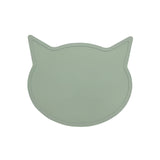 Green cat-shaped placemat on a light gray background