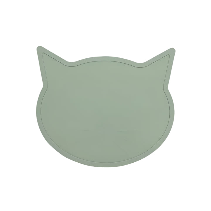 Green cat-shaped placemat on a light gray background